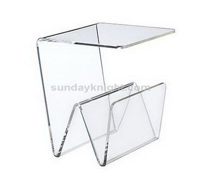 Clear acrylic table with magazine holder