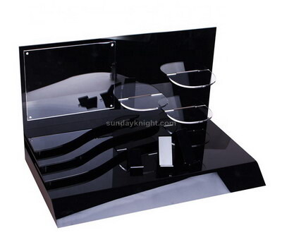 Black acrylic display stand for perfume