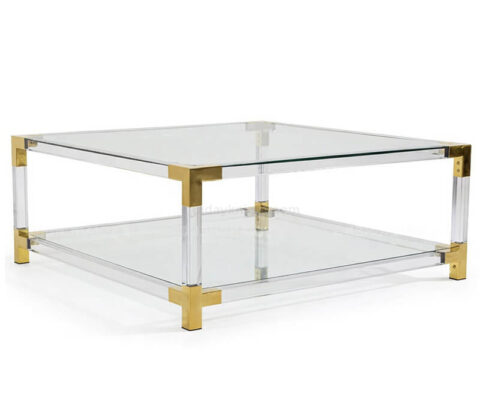 Mesa de centro de acrílico transparente con esquinas de latón